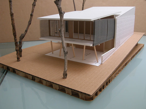 Screened guest house extends into low tree canopy