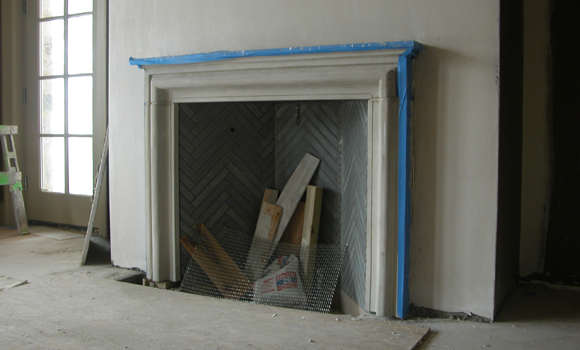 Dining room fireplace with herringbone soapstone interior ... and site debris