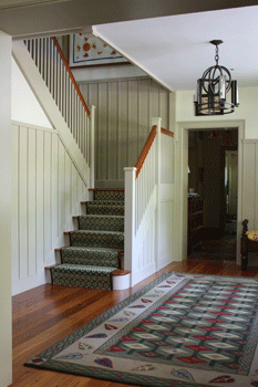 Entry foyer with high painted wainscot.